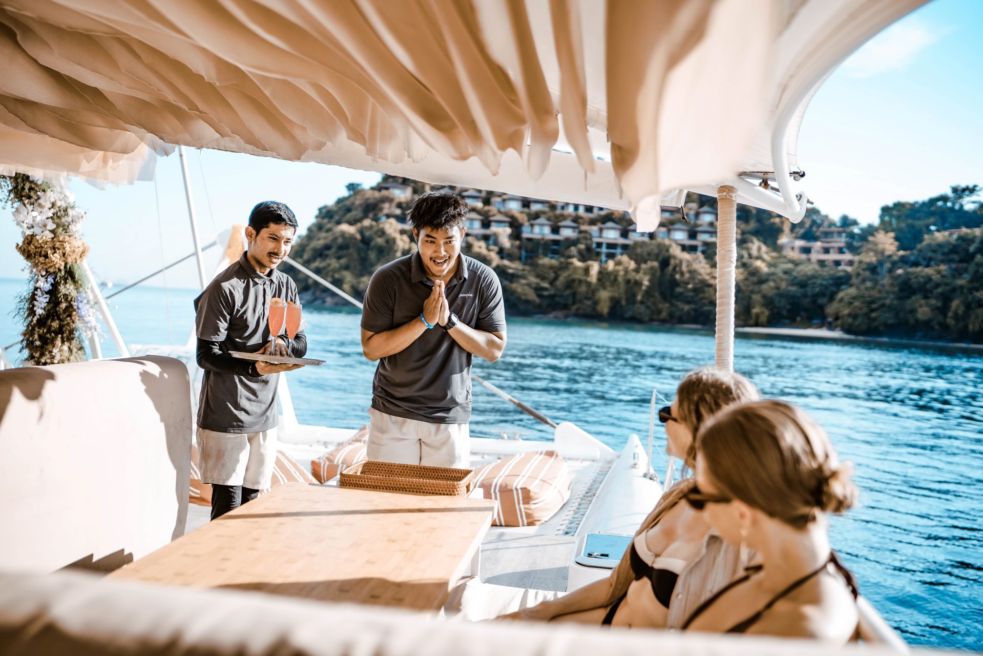 109 Thailand Travel team welcoming guests on a private yacht in Phuket